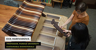 Dr. Eva Haviarova and a graduate student look over a bench made of heat-treated woods