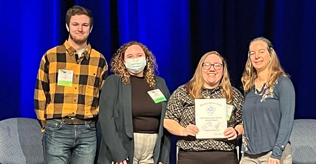 Purdue student chapter of the American Fisheries Society receiving the Most Active Student Subunit Award , also pictured electrofishing