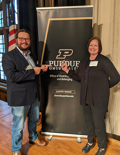 Illinois-Indiana Sea Grant's Stuart Carlton and Kara Salazar with the team's finalist award at the Diversity, Inclusion and Belonging awards ceremony