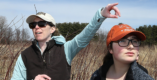 Liz Flaherty in field with students, wildlife ecology class, Purdue Forestry and Natural Resources.