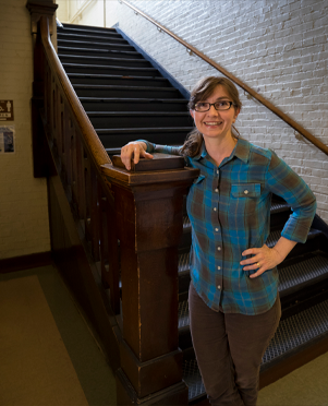 Dr. Eva Haviarova poses next to a stairwell