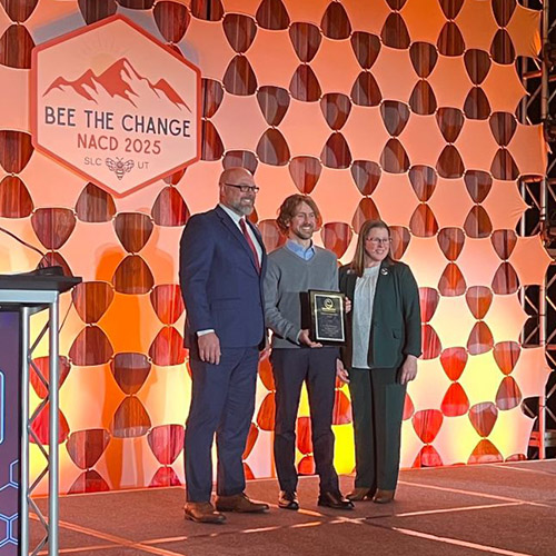 Dr. Rod Williams and extension wildlife specialist Nick Burgmeier accept the NACD Friends of Conservation Award.