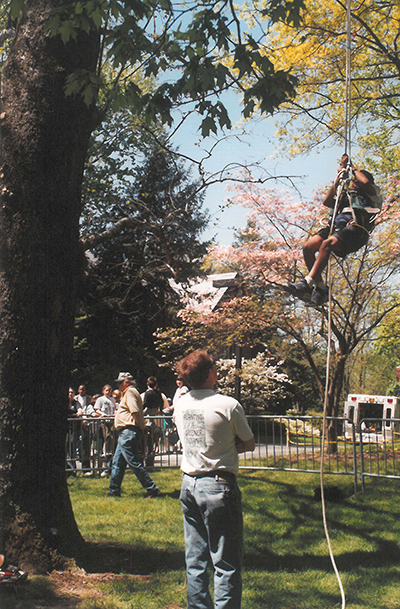 Tree Climbing on campus with Harvey Holt overseeing in the background