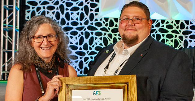 2004 alumnus Tom Lang receives the 2022 Meritorious Service Award from the American Fisheries Society. 