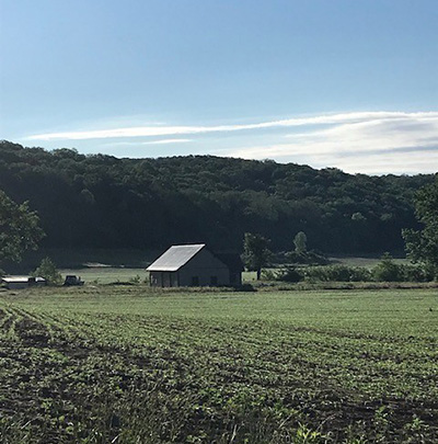 A barn, farm land and forest land on the Milnes Family Farm