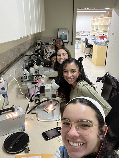 Arlene Polar Piniero in the lab with classmates