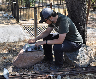 David Savage programs a Wildlife Acoustics Song Meter 3 sensor at Stony Hill Vineyard in California