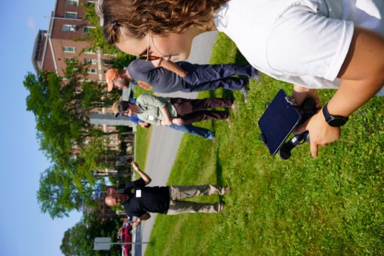 person outside using handheld drone controller 