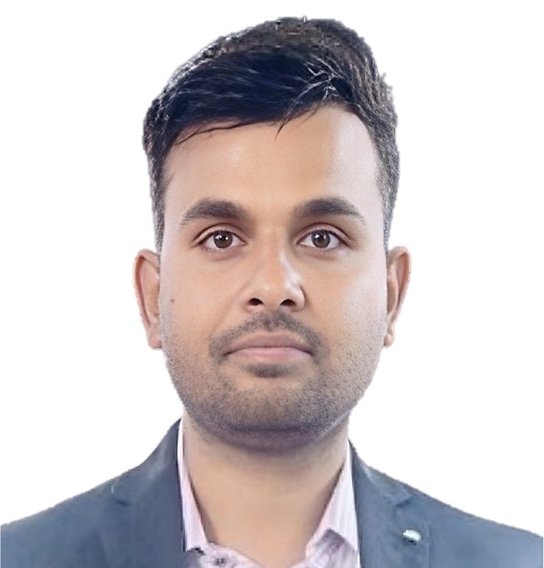Rajiv in front of a white screen 