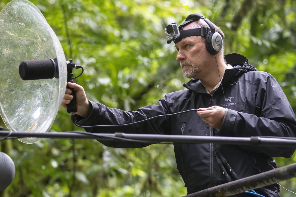 Bryan Pijanowski uses parabolic microphone to listen to nature.