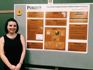 Brown with research poster.