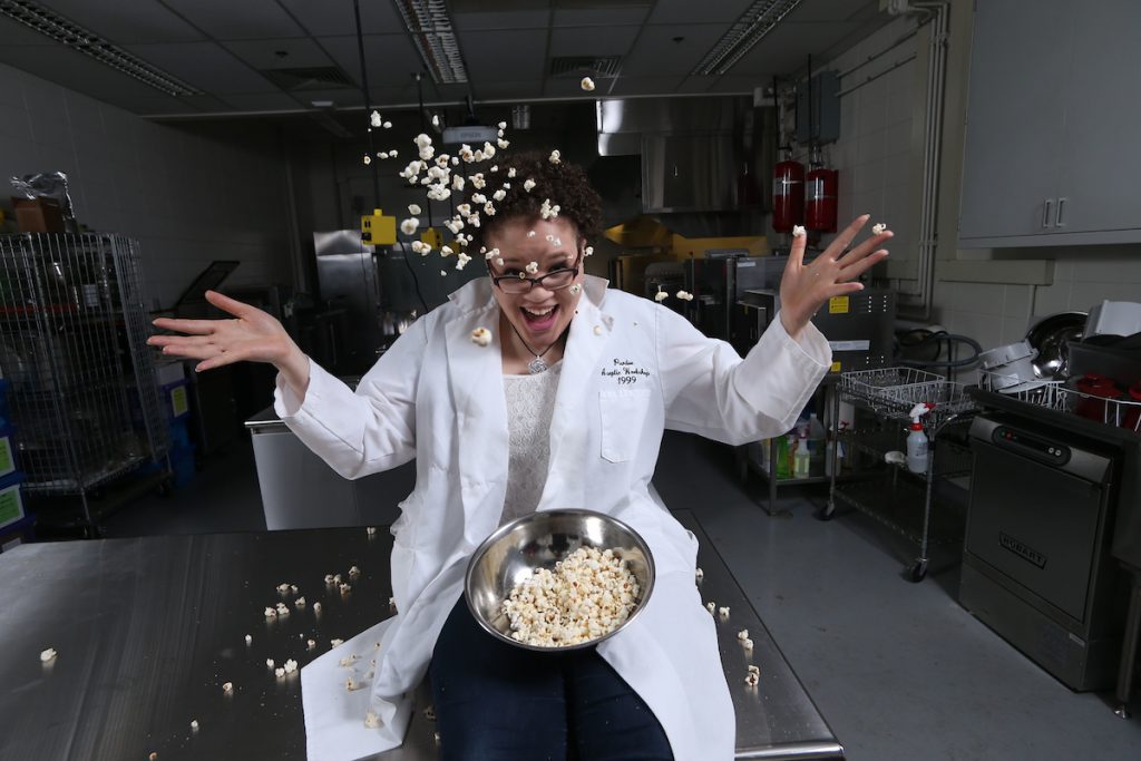 Food Science student, Cameron Wicks, is testing different flavored popcorn.