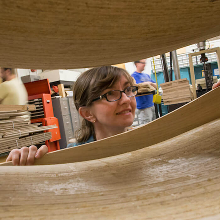 Haviarova looks over wood projects in the workshop