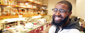 Brandon Hunter smiling in research lab
